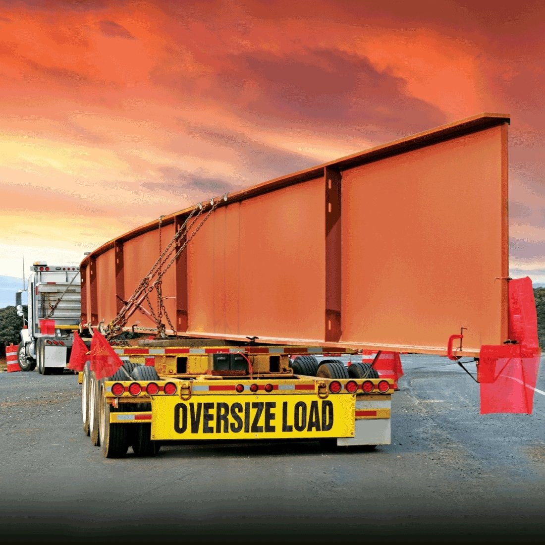 wide load truck side projection with orange safety flags